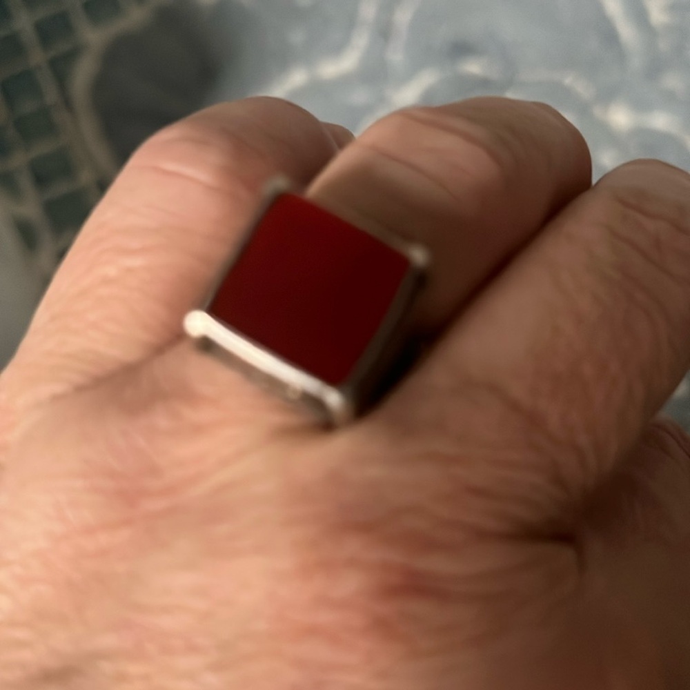 A silver ring with cornelian stone